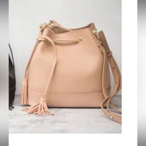 100% Leather bucket bag/backpack with tassels and matching coin purse attachment